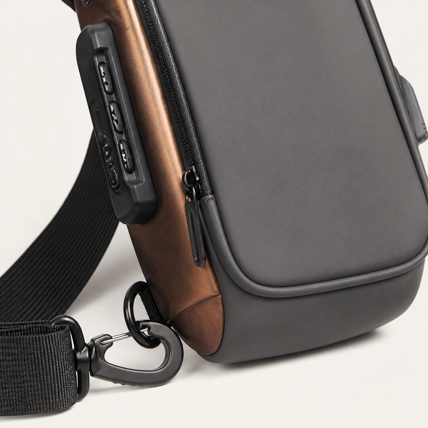 Gray hard shell chest sling bag with Gold Trim zipper and hardware detail — view 7