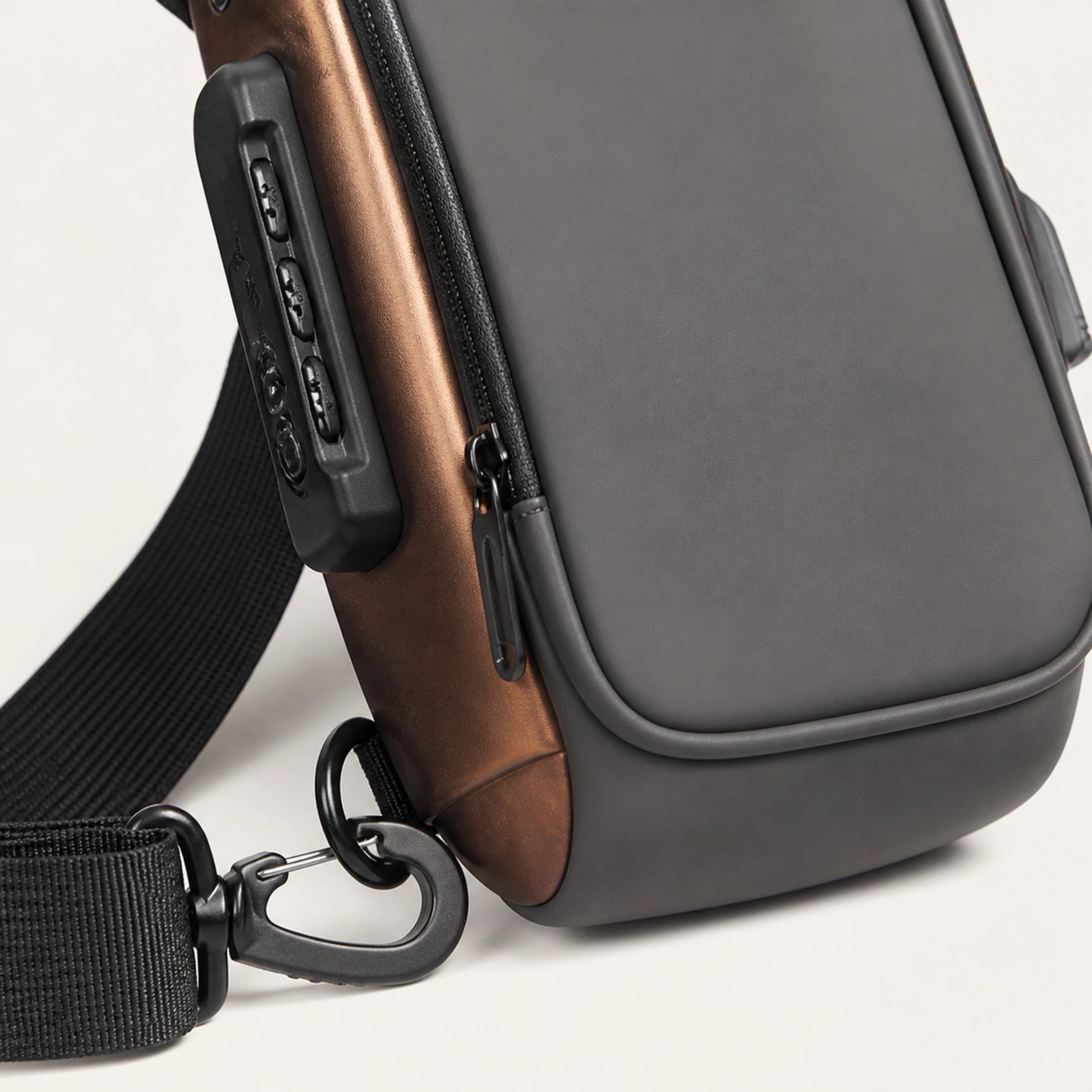 Gray hard shell chest sling bag with Gold Trim zipper and hardware detail — view 7