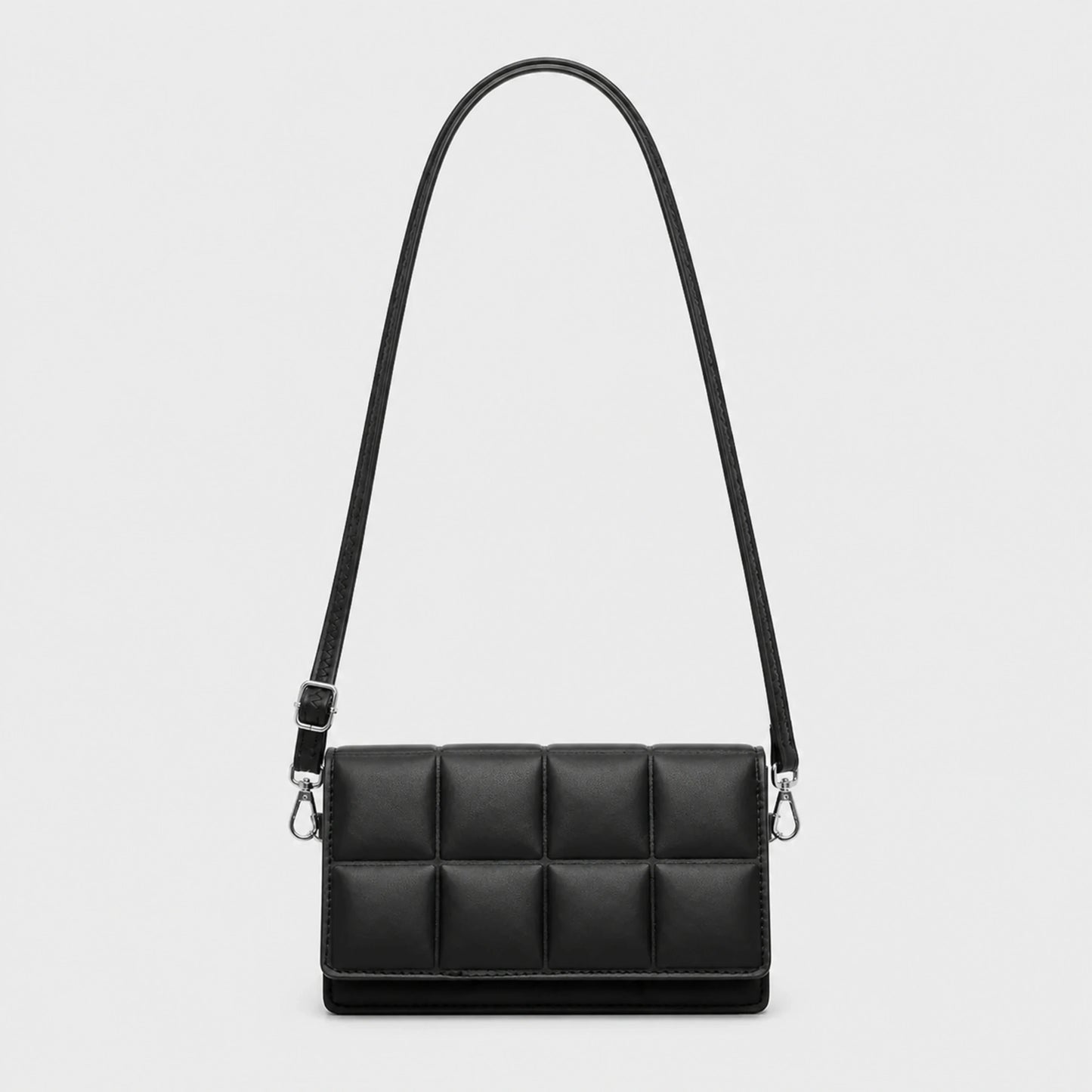 Black quilted sling bag complete front view — view 2
