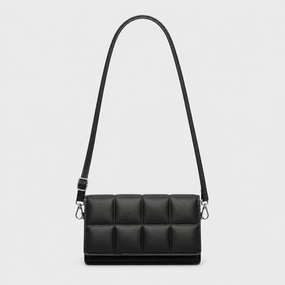 Black quilted sling bag complete front view — view 2