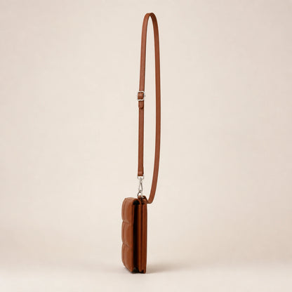 Warm brown quilted sling bag side view — view 5