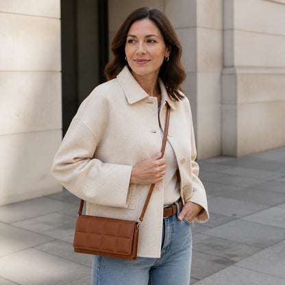 Adult woman wearing warm brown quilted sling bag — view 7