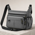 Gray multipocket crossbody sling bag complete front view