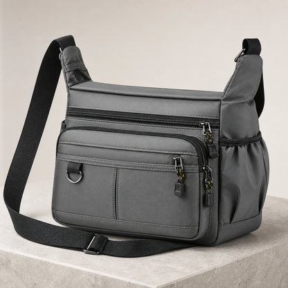 Gray multipocket crossbody sling bag complete front view