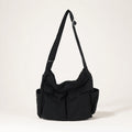 Black vintage multi pocket canvas sling bag complete front view