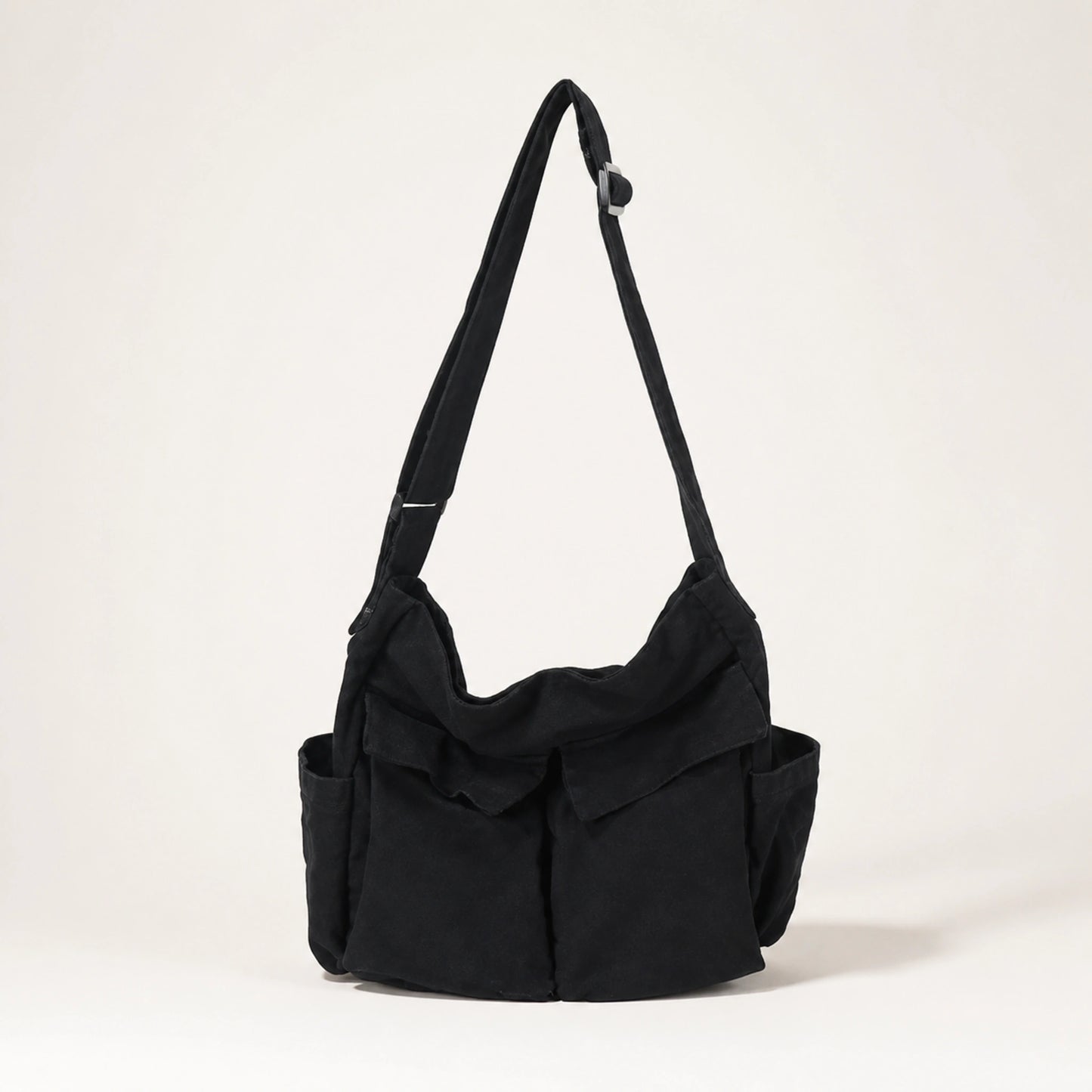 Black vintage multi pocket canvas sling bag complete front view