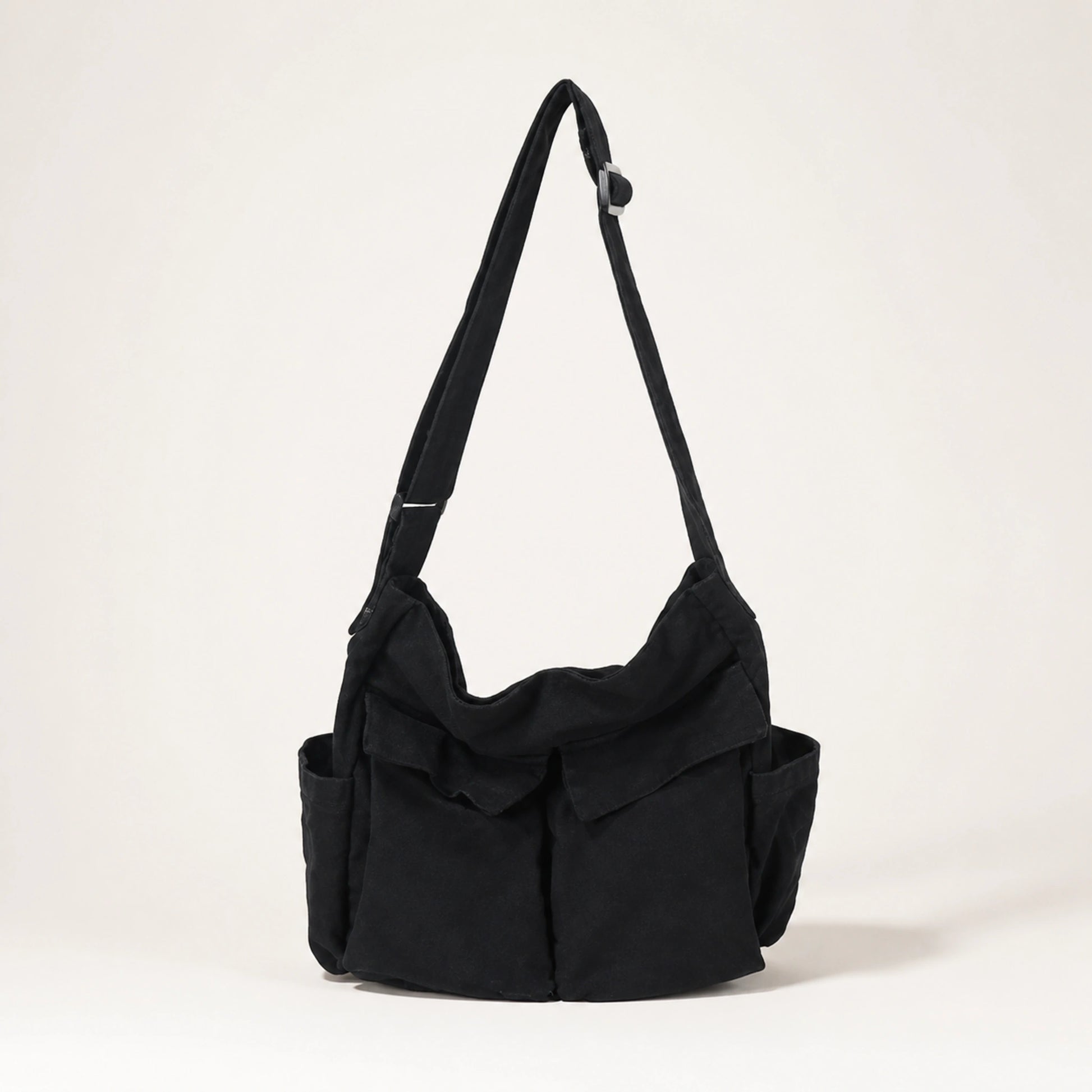 Black vintage multi pocket canvas sling bag complete front view