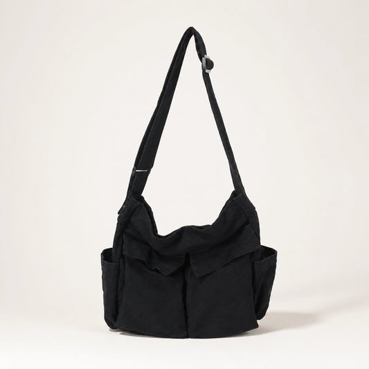 Black vintage multi pocket canvas sling bag complete front view