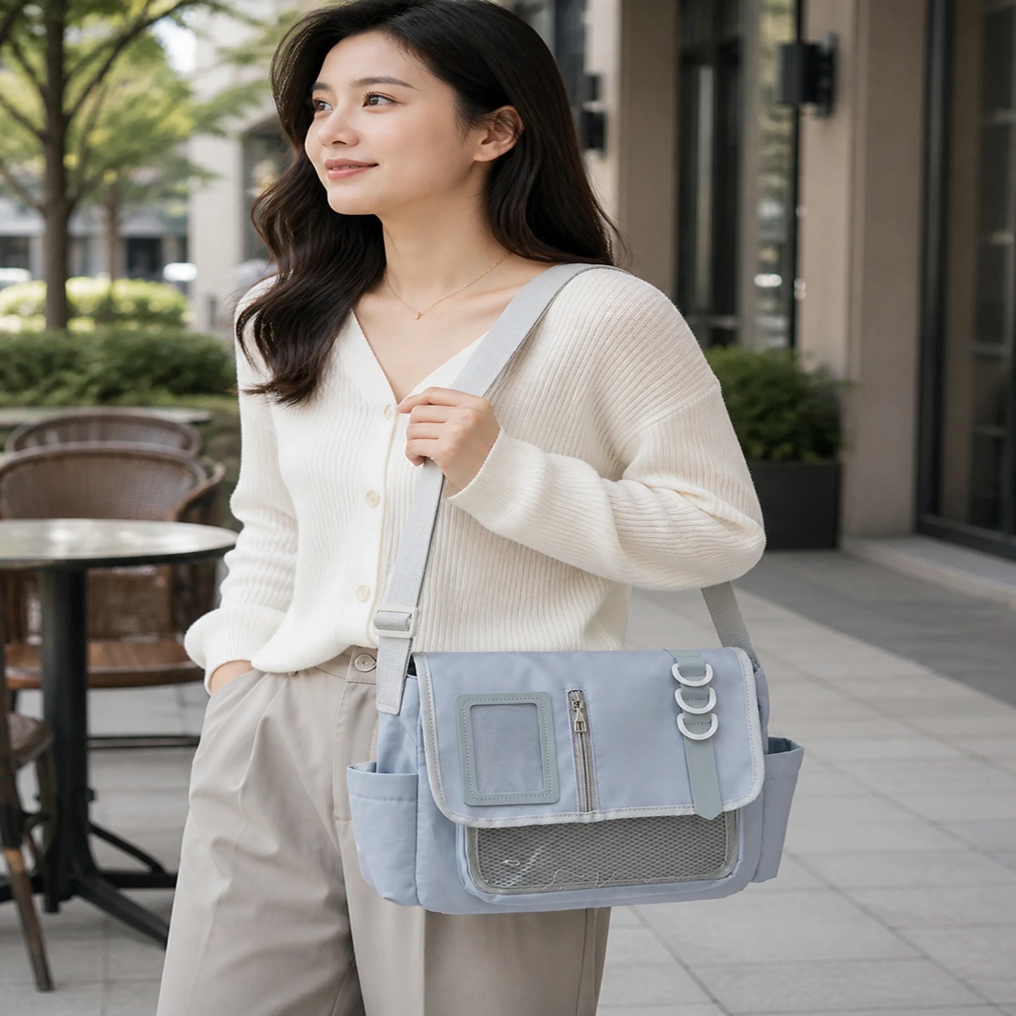sling bag — Adult woman wearing Powder Blue large nylon messenger display bag — view 12