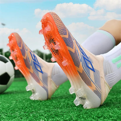 High top soccer cleats with orange soles and blue accents on grass field — view 18 — view 10