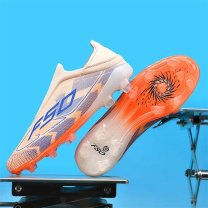 High top soccer cleats in beige and orange with textured sole, displayed against a blue background — view 8 — view 3