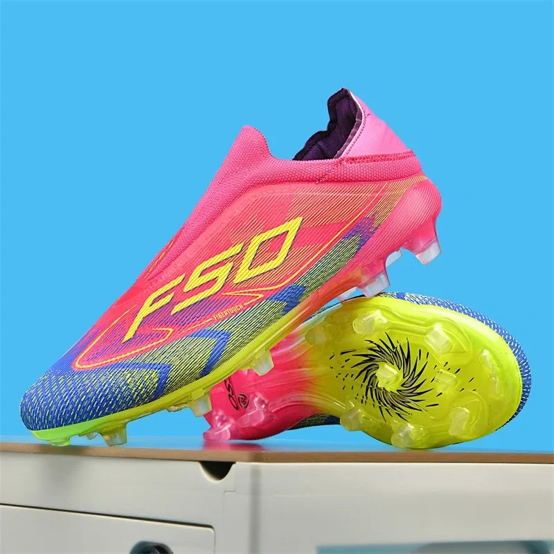 Bright pink and yellow high top soccer cleats with textured pattern studded soles — view 12 — view 7