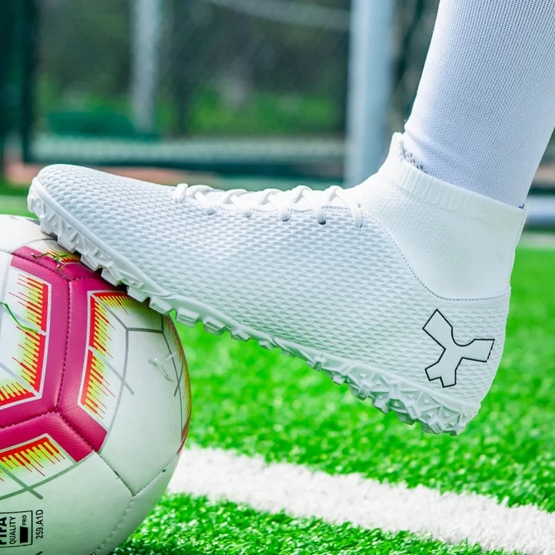 White high performance soccer cleats with textured design on a green field, close up view — 5 — view 5
