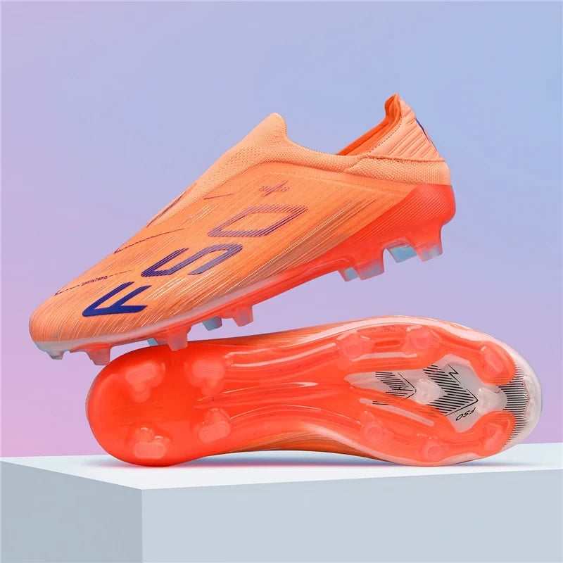 Orange high top soccer cleats with textured sole and non slip design, displayed on a platform — view 11 — view 12