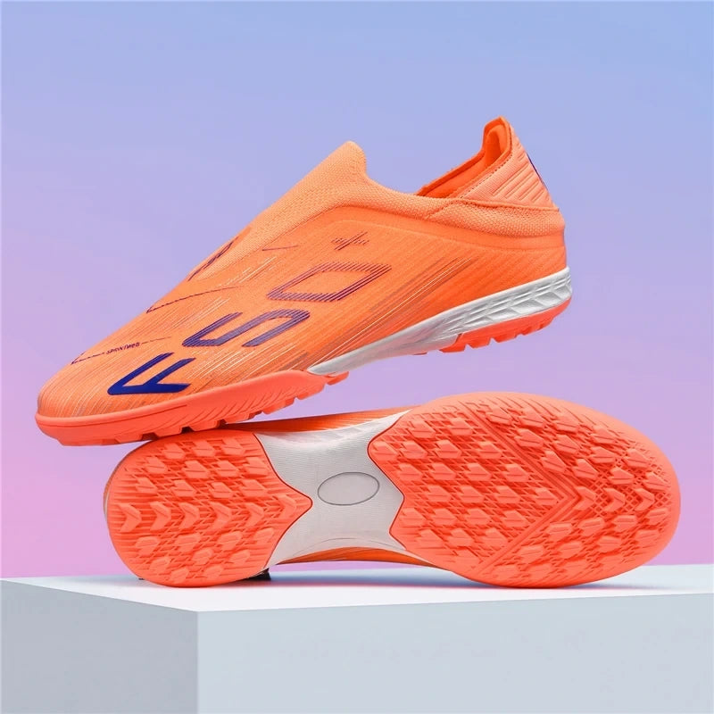 Orange high top soccer cleats with non slip soles on display against a gradient background — view 16 — view 17