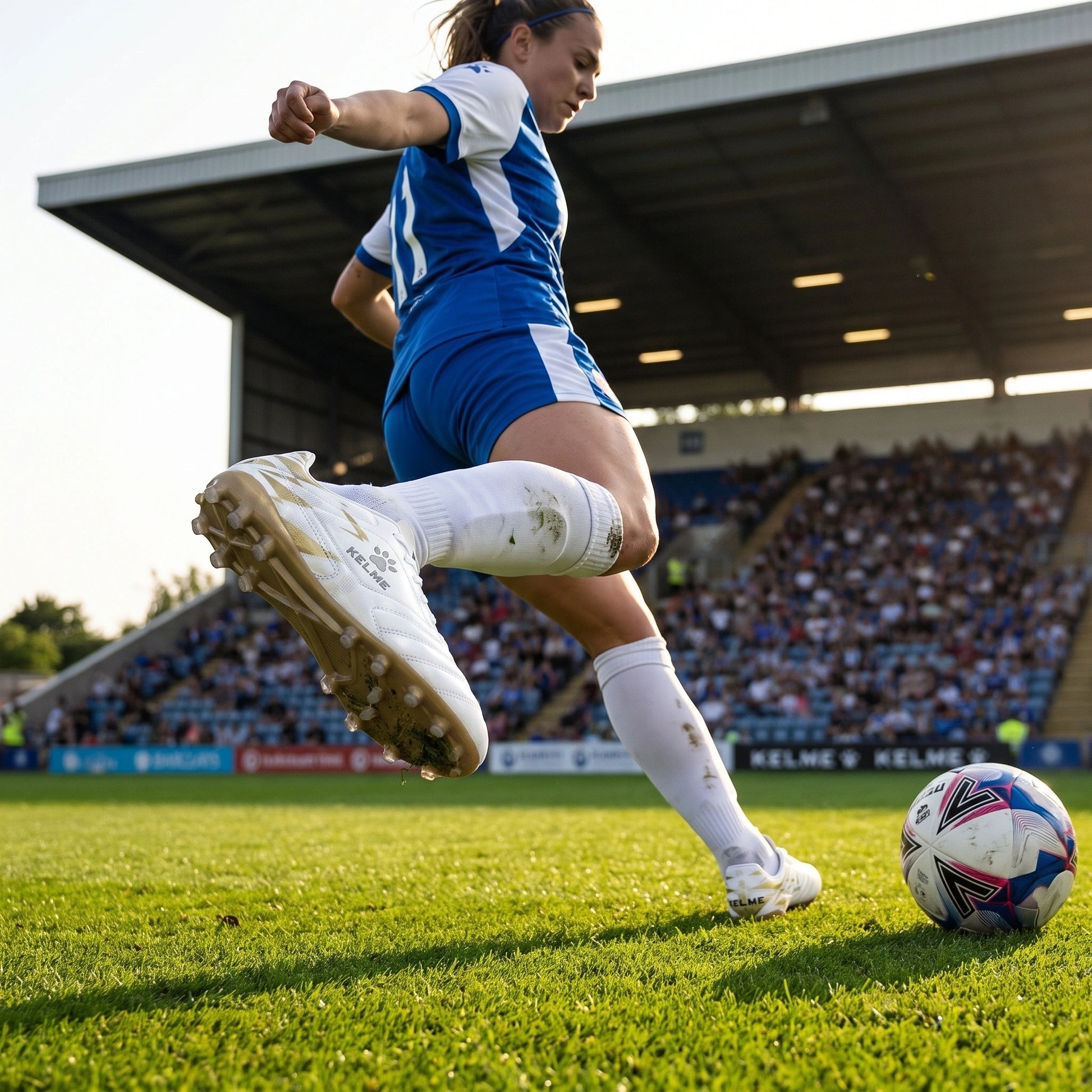 Close up view of the professional short nail soccer cleats showing durable polyester material, intricate stitching — view 3