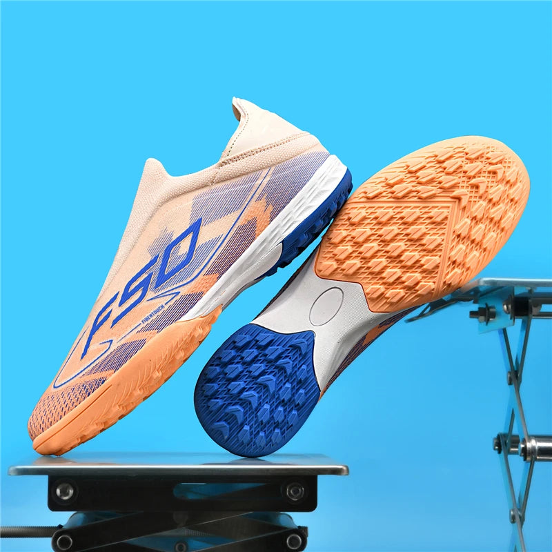 Beige soccer cleats with blue and orange soles, showcasing non slip design on a background — view 15 — view 8