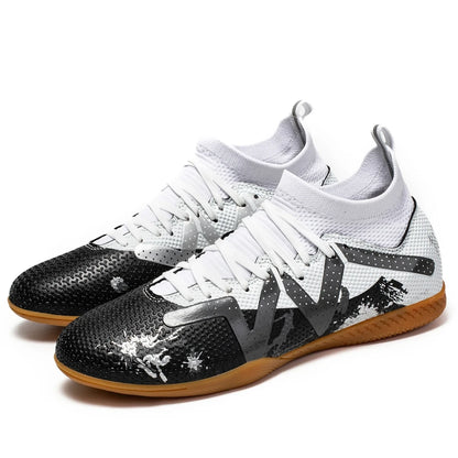 Black and white soccer cleats with textured surface lace up design, angled view — 7