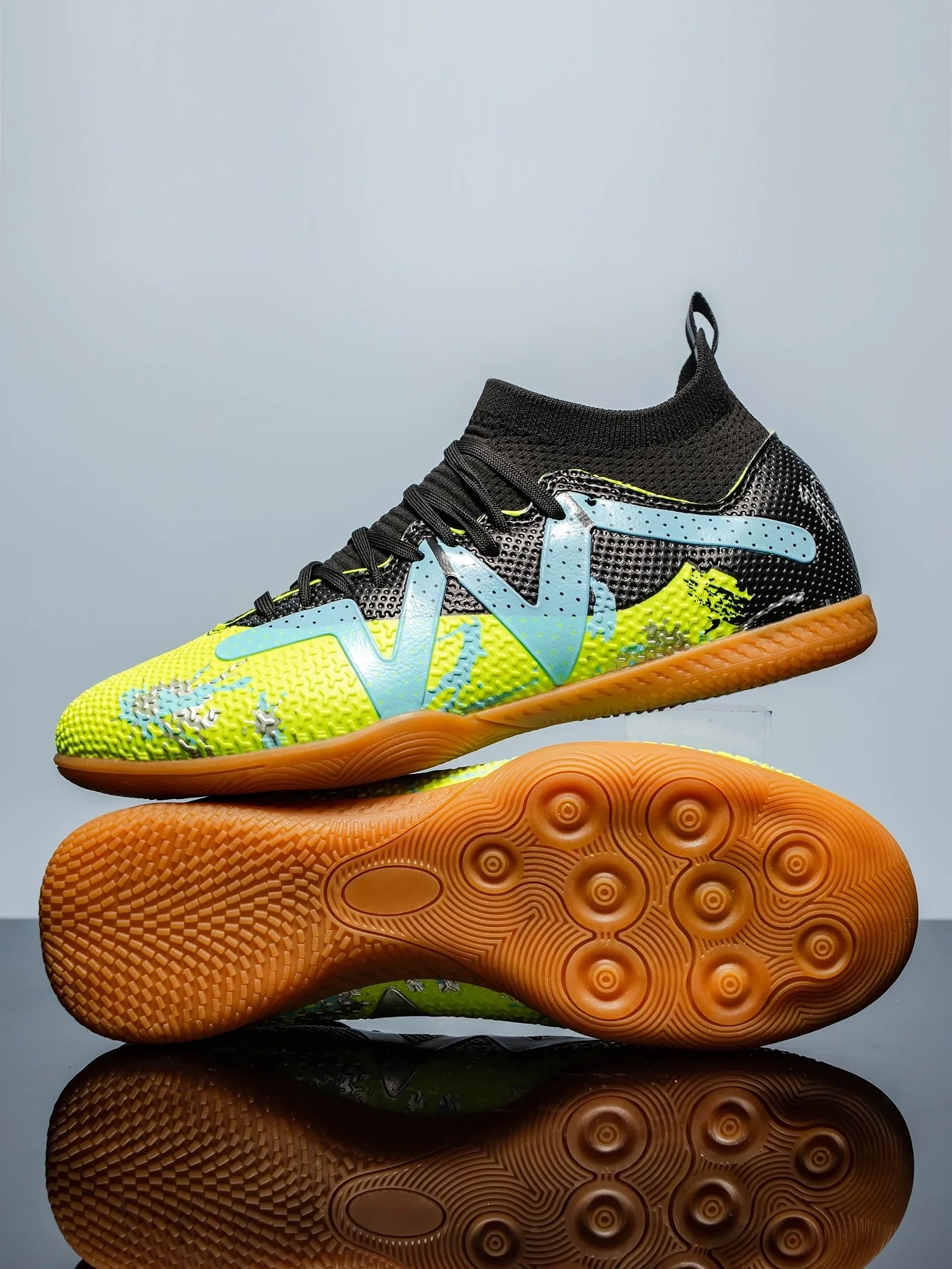 Yellow and black soccer cleats with textured sole blue accents, side view — 12 — view 5