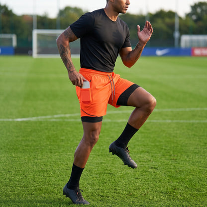 Close up of the breathable fabric and precise stitching men's double layer soccer shorts, showing their quality — view 14