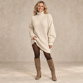 sweater dress — Image; complete full front view; Beige celeste garment worn by a happy adult model