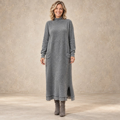 sweater dress — Image; complete full front view; Gray noelle garment worn by a happy adult model