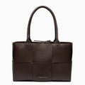 Woven tote bag featuring a chic design, crafted from natural materials in neutral color, top view