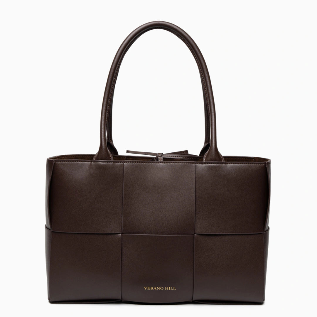 Woven tote bag featuring a chic design, crafted from natural materials in neutral color, top view