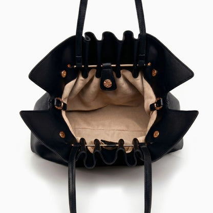 Soft beige tote bag with a spacious interior and sturdy handles, displayed — view 5 — view 5