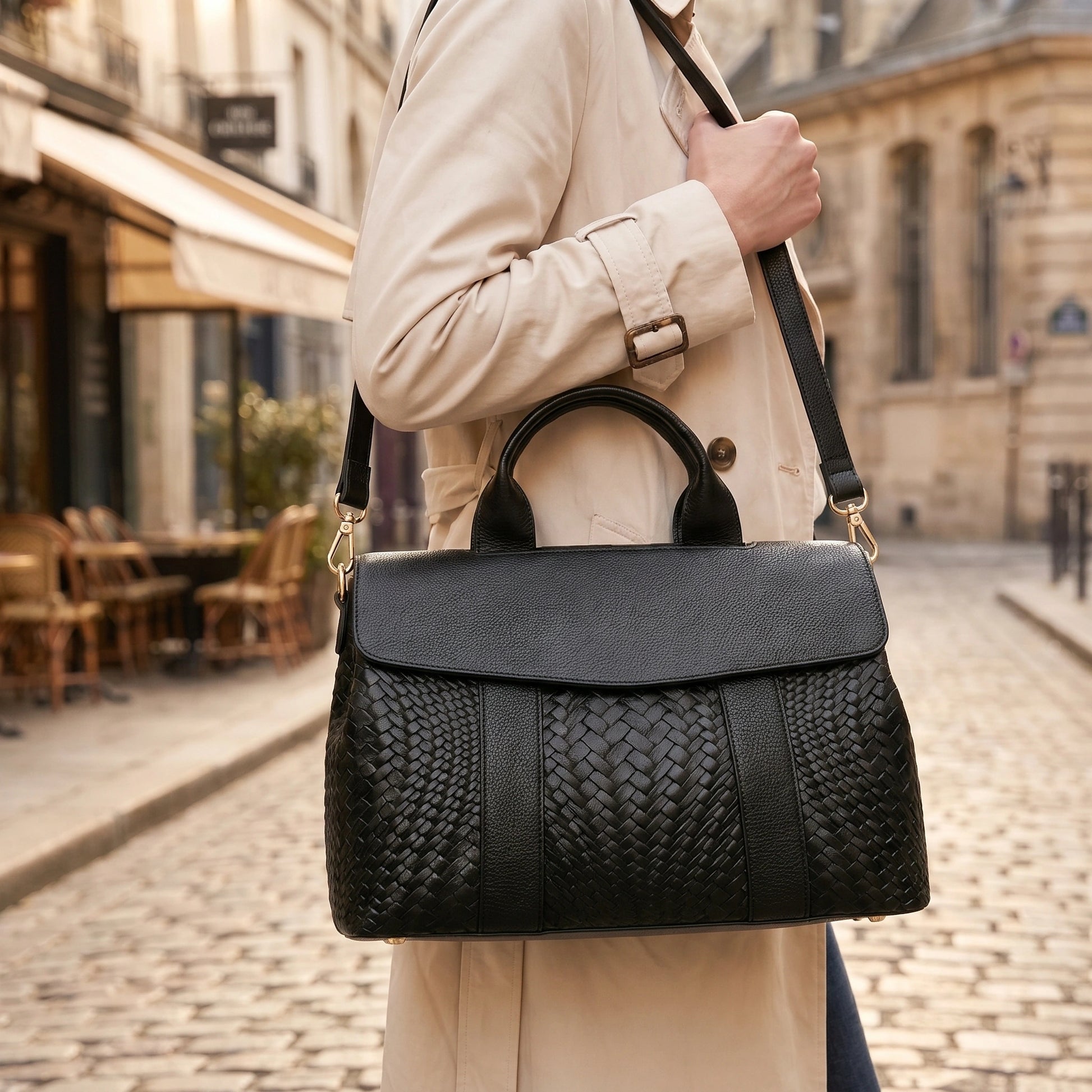 A model showcases the Everyday Tote Bag in outfit showing neutral tones, set against minimalist urban backdrop.