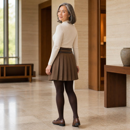 uniform skirt — Rear three quarter view of a mature woman wearing the coffee brown pleated line skirt, showing back — view 5