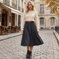 A model showcases high waisted line polyester uniform skirt in navy, paired with fitted blouse against neutral background.