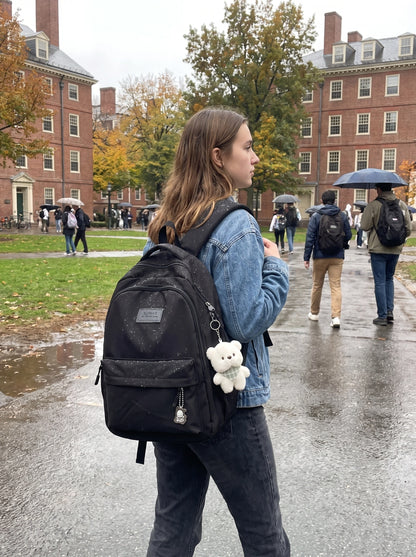 Close up of the waterproof fabric and precise stitching roomy university backpack, showing its durability high — view 3