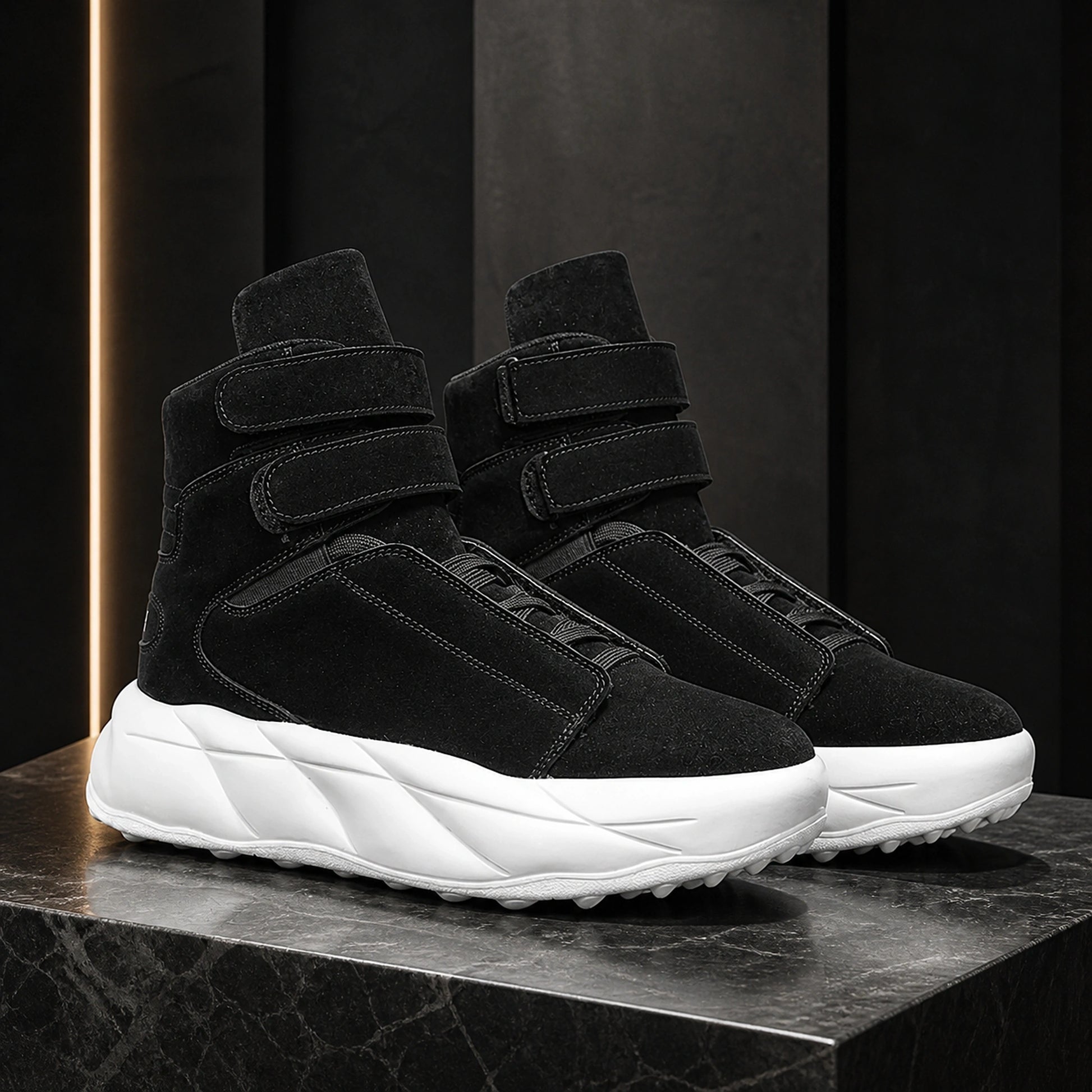 Black men's high top platform velcro shoes on a graphite set