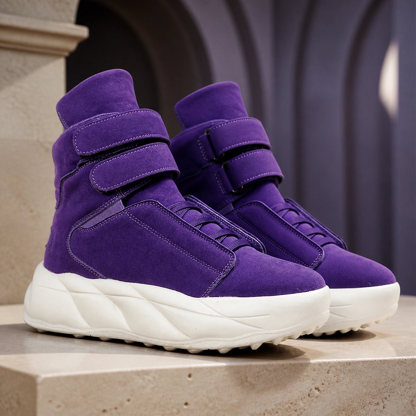 Purple men's high top platform velcro shoes on a warm architectural set — view 2