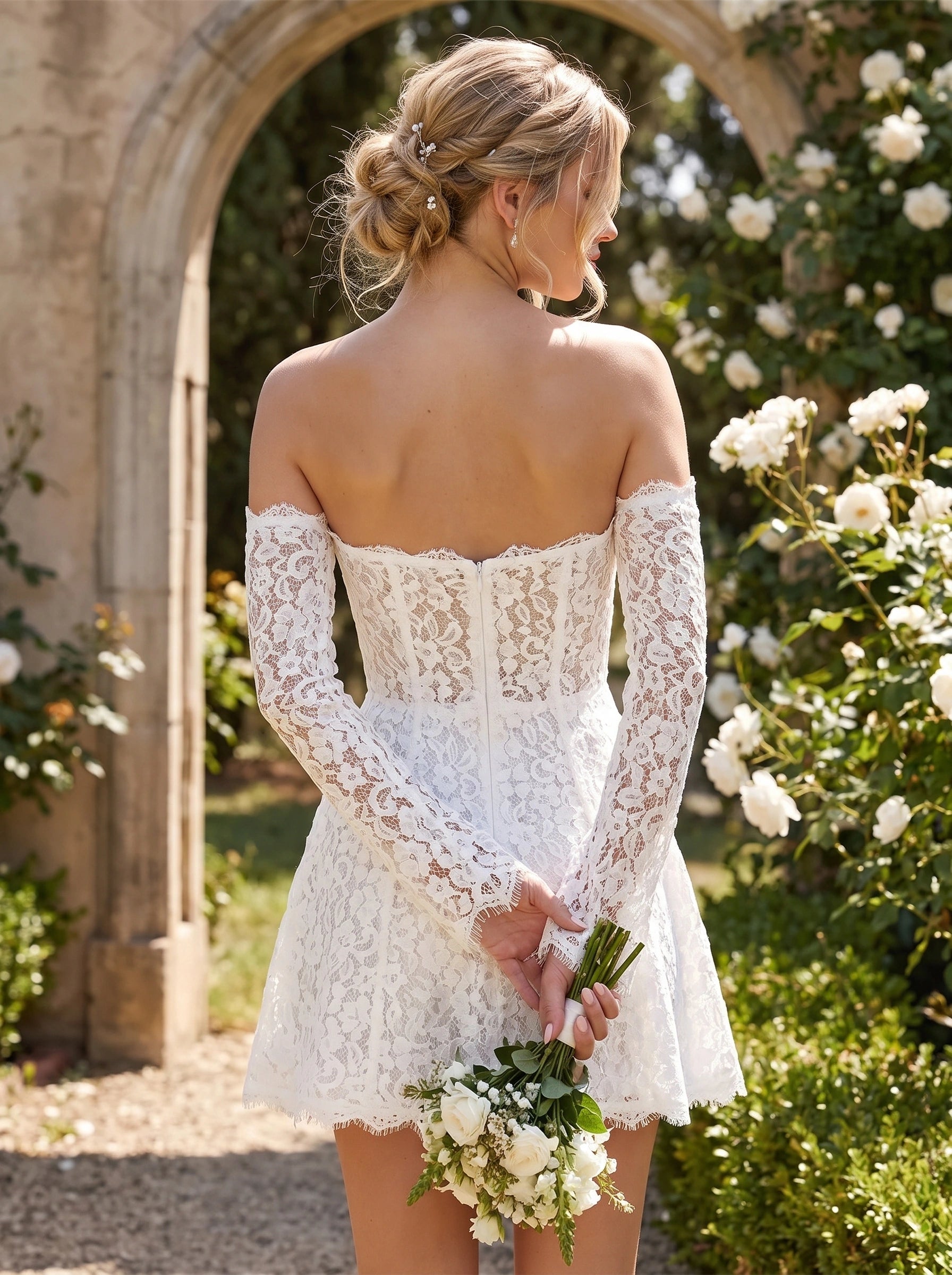 Back view of a model showing the women's modern lace detachable sleeve mini wedding dress, intricate detailing and — view 2