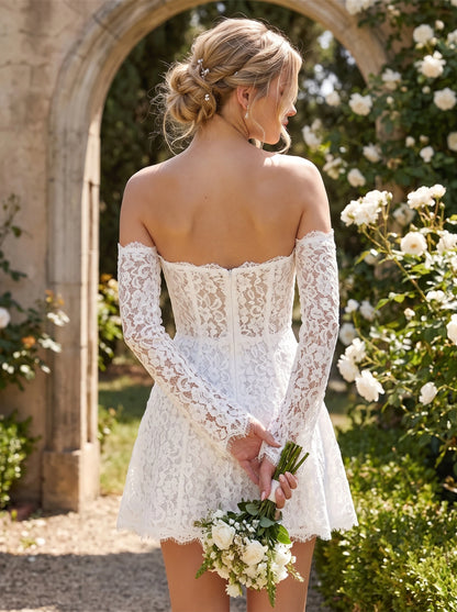 Back view of a model showing the women's modern lace detachable sleeve mini wedding dress, intricate detailing and — view 2