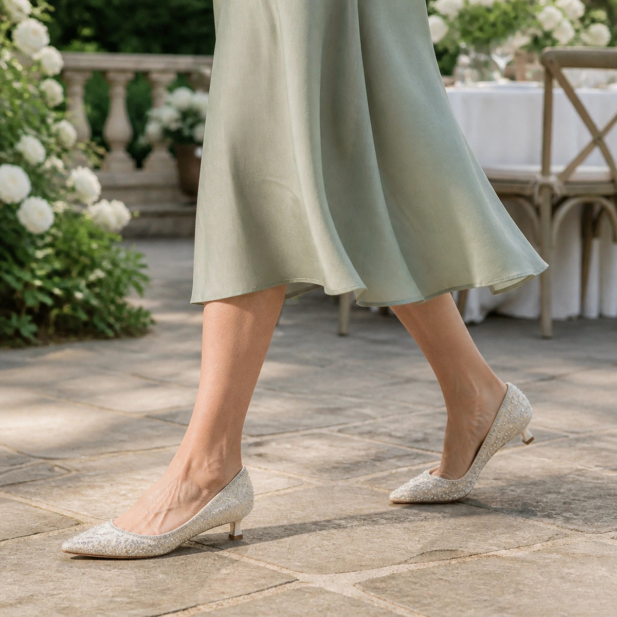 wedding guest shoes — Mature woman wearing ivory pearl 4 cm wedding guest pumps outdoors — view 8