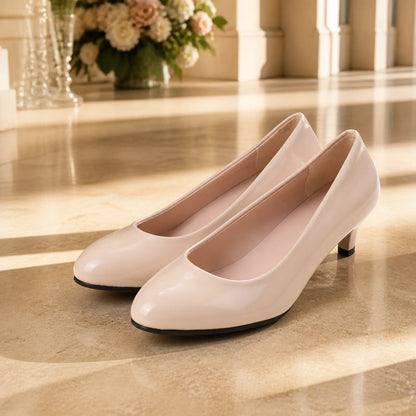 wedding guest shoes — Nude patent low heel wedding guest pumps complete front view