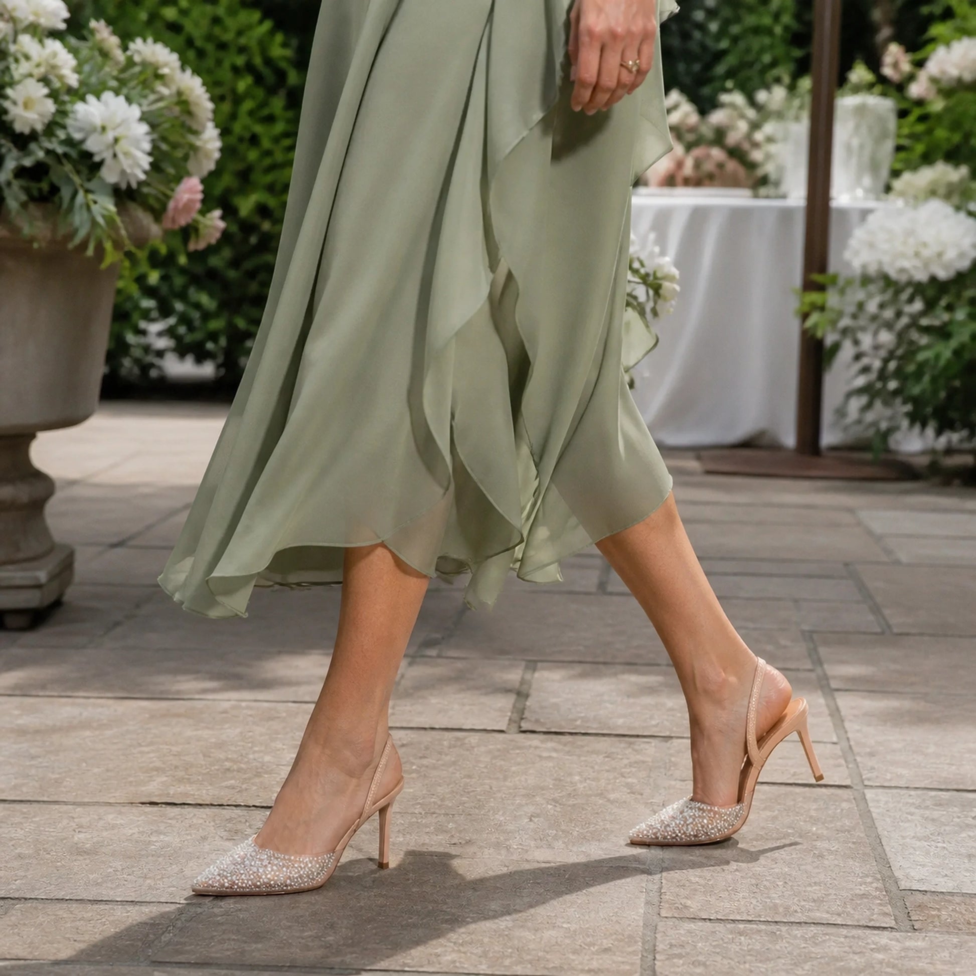 wedding guest shoes — Mature woman wearing nude ivory pearl slingback shoes outdoors — view 7