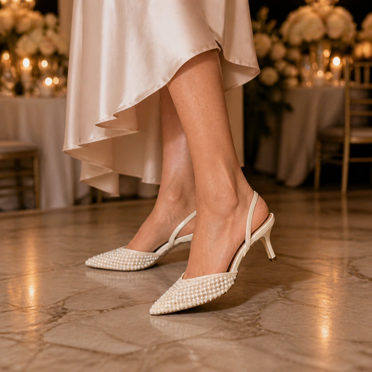 wedding guest shoes — Mature woman wearing ivory pearl slingback heels at an indoor reception — view 6