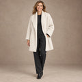 winter coat — Image; full front view; Cream; complete product worn by a happy adult model