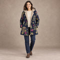 winter coat — Image; full front view; Navy Floral; complete product worn by a happy adult model